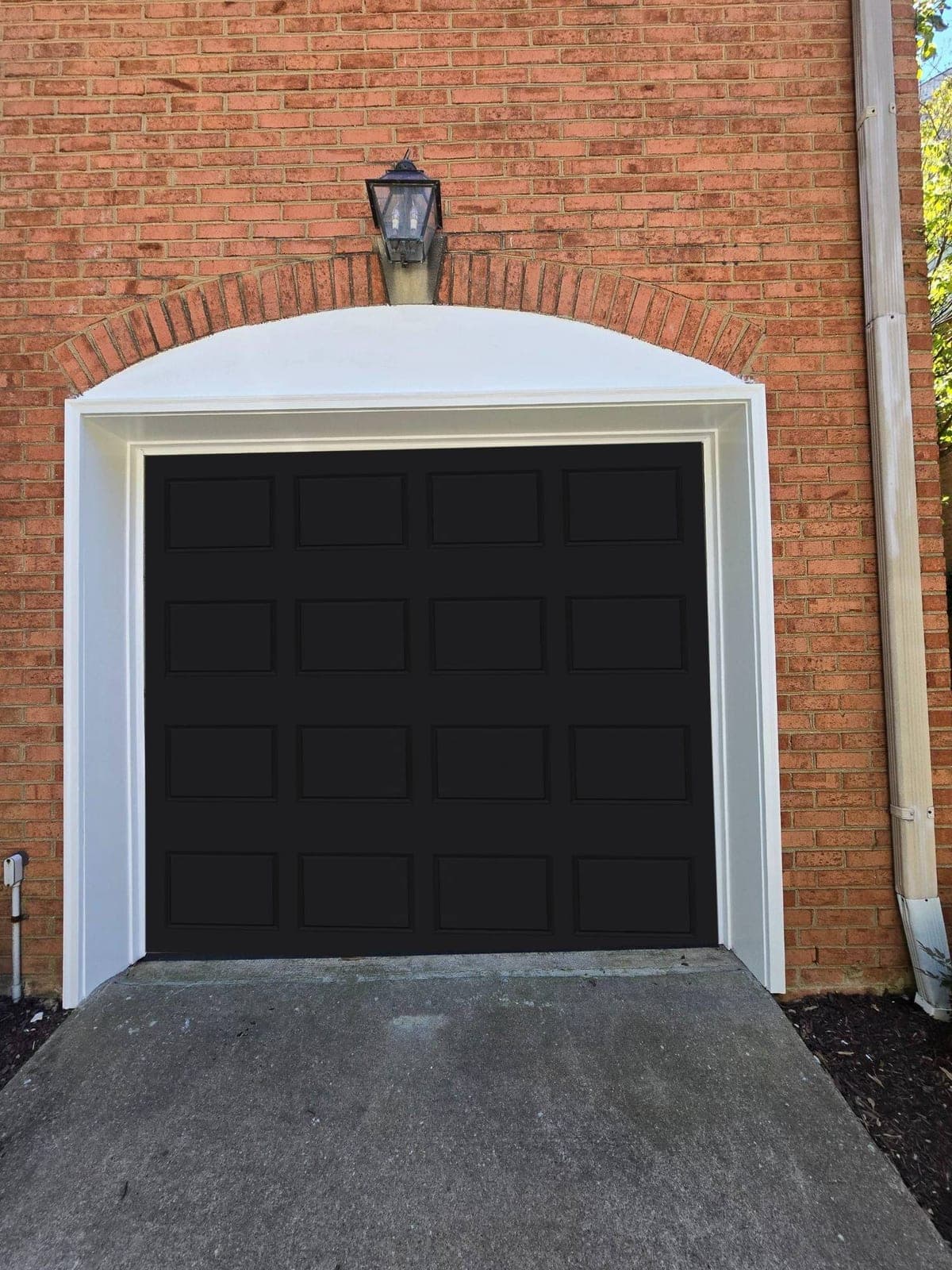Bold black coach-style door installed by GarageWiz in Rockville, MD
