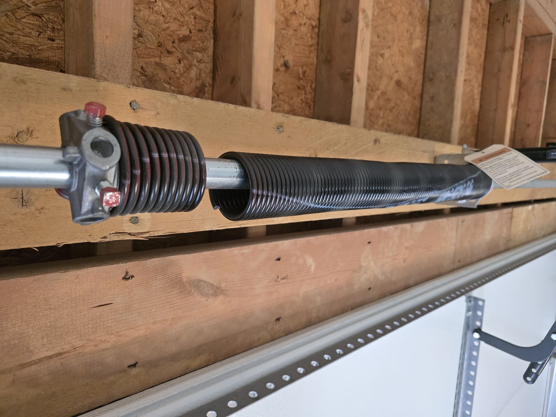 Torsion vs extension springs: which does your garage door have?
